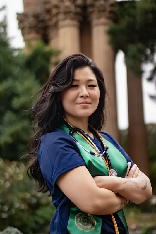A woman with a stethoscope, arms crossed